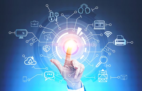A finger points at a light in the center of an illustration depicting many internet-connected devices.
