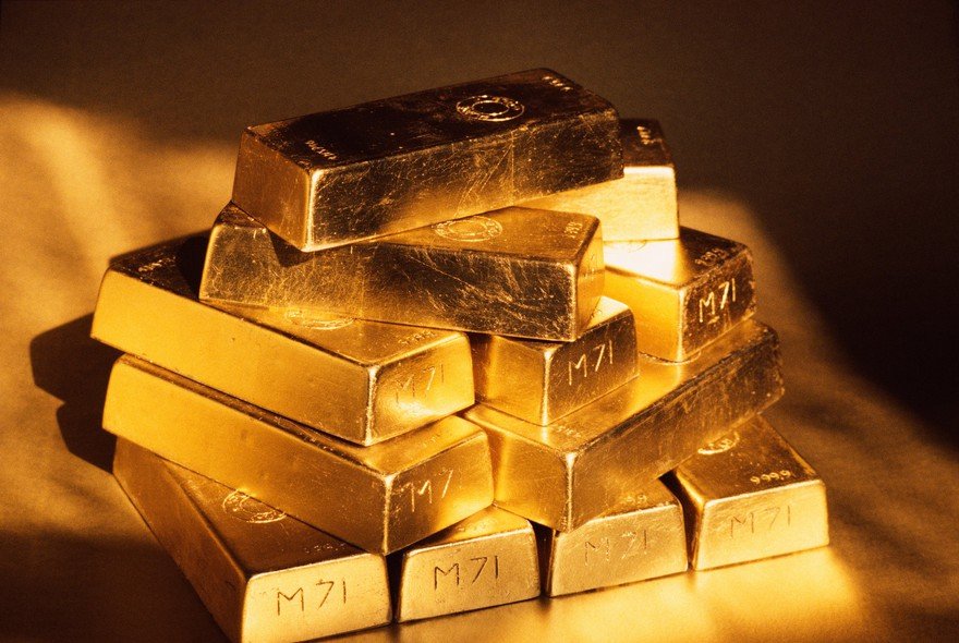 Gold ingots stacked on top of one another.